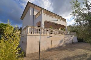 a house with a balcony on the side of it at Casa en Montferrutx in Colonia de Sant Pere
