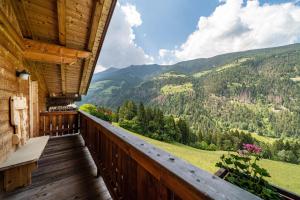a balcony with a view of the mountains at Marschalkhof Sankt Helena in Motini al Rio +9 photos