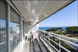 a balcony with a view of the ocean at Maria apartment in Blanes