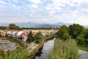 a view of a town with a river and buildings at Attico con terrazza a Viareggio in Viareggio