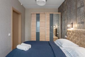 Postel nebo postele na pokoji v ubytování Cozy One-Bedroom Retreat in Klaipėda I Cohost