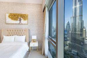 Postel nebo postele na pokoji v ubytování Stunning Burj View High Floor EB + 45 fotografií