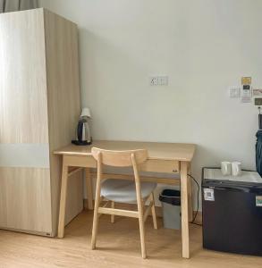 a wooden table with a chair next to a desk at DNh Phu Quoc - Bãi Dài in Phu Quoc +35 photos