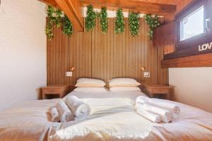 Una cama o camas en una habitación de Val di Sole Apartment