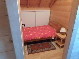 a small room with a bed and a table at Chalet Montagne Pontis face Ecrins in Pontis