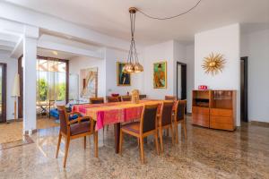 a dining room with a table and chairs at Casa Kyona in Artá