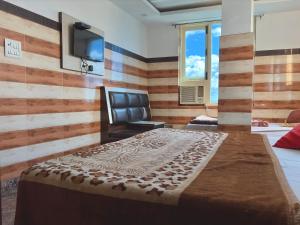 TV a/nebo společenská místnost v ubytování Ashoka Residency + 6 fotografií