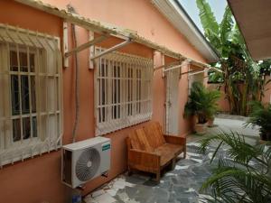 a house with a heater and a chair and a fan at Mpita 2 in Pointe-Noire