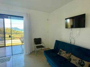 A television and/or entertainment centre at Apart-Hotel "Encantos do Mar" - Beira Mar