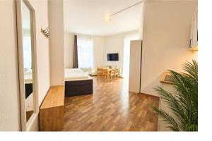 a living room with a couch and a table at LUMA Apartments in Dresden