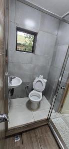 a bathroom with a toilet and a sink at Cooper in Potchefstroom