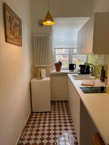 Kuchyň nebo kuchyňský kout v ubytování Apartament przy księgarni