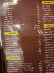 uma visão do menu do restaurante em Hotel shree ji palace em Pāldhi