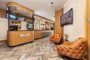 a bar in a hotel lobby with a barber shop at Hotel BLVD 7 in Plovdiv