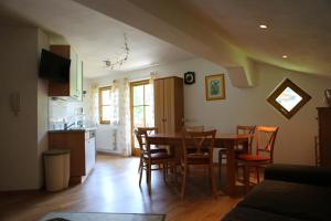 a kitchen and dining room with a table and chairs at Ferienhaus Kahr in Radstadt