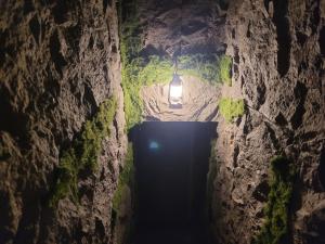 a light at the end of a tunnel in a cave at La Comté à Blagnac in Blagnac