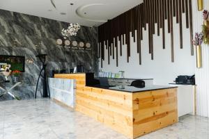 a kitchen with a counter with knives hanging on the wall at Madison Suites in Lapu Lapu City