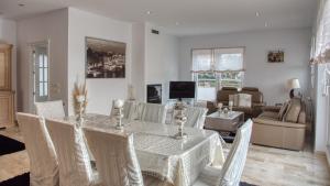 a dining room with a table and chairs at Costacabana - Villa Madison in Lloret de Mar