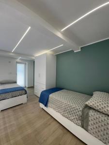 Postel nebo postele na pokoji v ubytování AparthouseRisorgimento CANAPA
