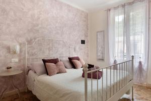 Ένα ή περισσότερα κρεβάτια σε δωμάτιο στο La Rosa Dei Venti