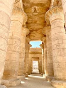an archway of a building with reliefs on the walls at Royal Home Dome Style - Ground Floor Apartment in Jazīrat al ‘Awwāmīyah +18 photos