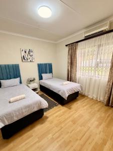 Ένα ή περισσότερα κρεβάτια σε δωμάτιο στο Nobelina Guest House