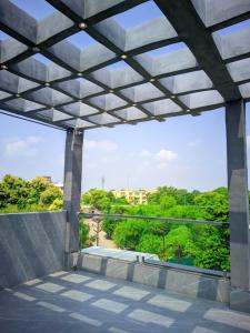 a view from the outside of a building with a large window at Hotel Pleasure Inn in Prayagraj