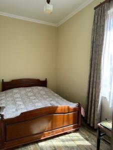 a bedroom with a bed and a window at Arpi GuestHouse Dilijan in Dilijan