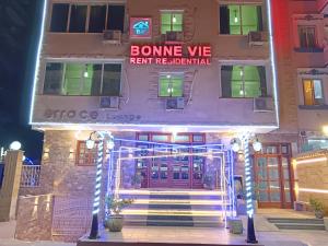 a building with a sign that reads bonne vofi rent beneficial at Bonne Vie Hotel in 6th Of October