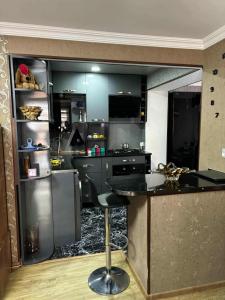 a kitchen with a counter and a bar in it at Dachi in Itʼkhvisi +3 photos