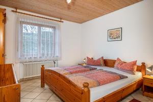 a bedroom with a large bed in a room at Ferienhaus Behler in Kressbronn am Bodensee