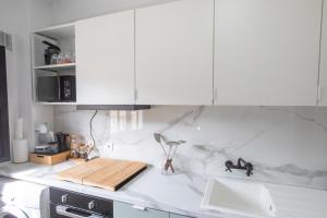a kitchen with a white counter top with a sink at Apartamento con vistas a la montaña en Cazorla in Cazorla +15 photos
