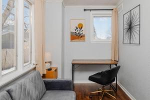 a living room with a couch and a table at Bungalow on Baldwin - 3 bed 2 bath in Oshkosh