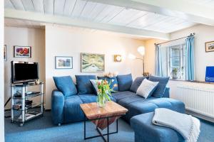 TV a/nebo společenská místnost v ubytování Ferienhaus Voß