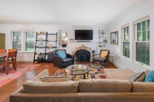 a living room with a couch and a fireplace at Family Brick House Charm - 4 br 3 bath in Appleton