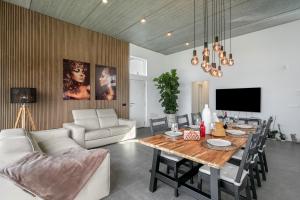 a living room with a table and a couch at Villa Carlota in Garachico
