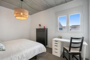 a bedroom with a bed and a desk and a window at Villa Carlota in Garachico +26 photos