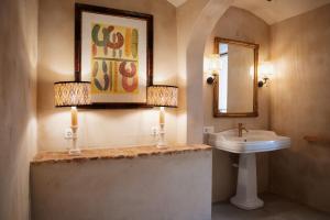 a bathroom with a sink and a mirror at Casa de Solís in Trujillo +54 photos