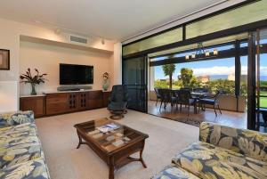 a living room with a couch and a table at Kaanapali Royal N102 · KRL N102 2BD Condo on Kaanapali Golf Cour in Lahaina