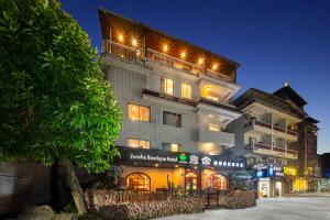 a large building with lights on top of it at Junshe Boutique Guest House-Complementary pick up servie for a 3-night stay in a deluxe room in Guilin