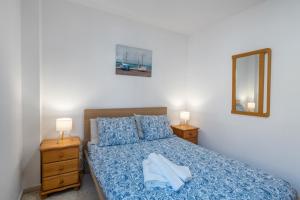 En eller flere senge i et værelse på Brisa de mar