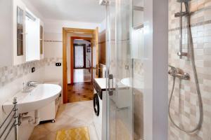 a bathroom with a sink and a shower at Appartamenti Minotto Falcade in Falcade +71 photos