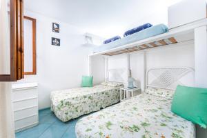 Ένα ή περισσότερα κρεβάτια σε δωμάτιο στο Holiday In Villasimius