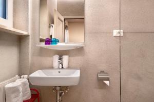 a bathroom with a sink and a mirror at Alter Fausthof in Fie allo Sciliar +56 photos