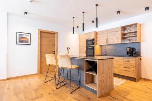 Kuchyň nebo kuchyňský kout v ubytování Carpe Solem Rauris by ALPS RESORTS