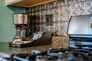 a kitchen with a counter top with a coffee maker at Downtown Home off College Avenue - Lawrence University in Appleton