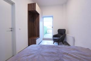 Ένα ή περισσότερα κρεβάτια σε δωμάτιο στο Wohnung IB - Apartment mit Privater Terrasse