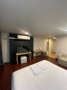 Ένα ή περισσότερα κρεβάτια σε δωμάτιο στο โรงแรม B24 Hostel