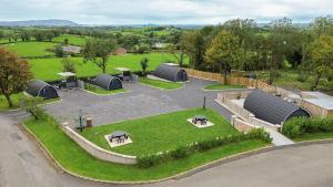 an aerial view of a garden with picnic tables and domes at Coolaness Glamping in Irvinestown