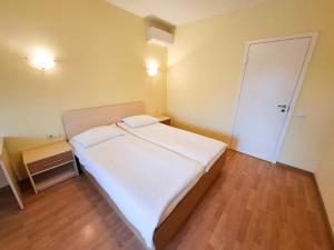 Postel nebo postele na pokoji v ubytování LUNA Marijampole + 27 fotografií
